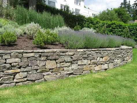 Building a Stone Retaining Wall - JCs Landscaping