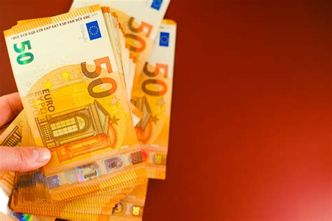 50 Euro Banknotes In Hand Expenses And Incomes In European Countries ...