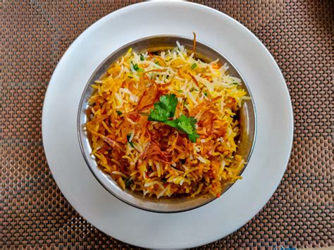 Dum Biryani Served In A Steel Pot Top View Stock Photo - Download Image ...