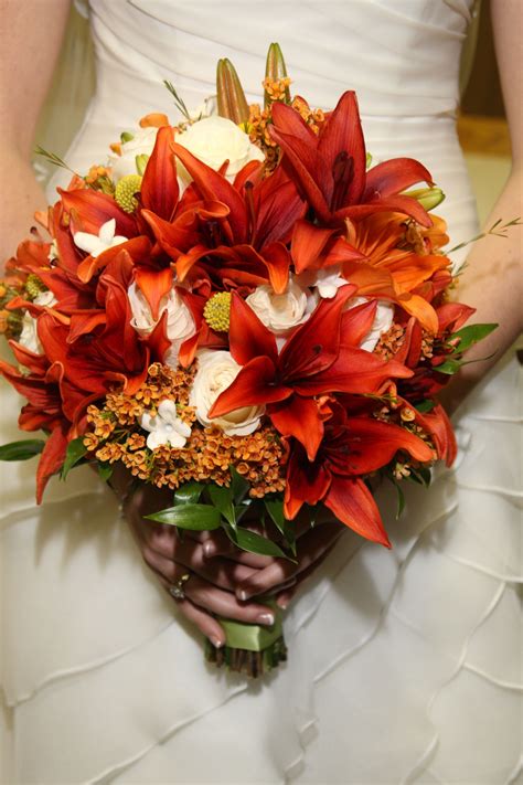 Bride's fall bouquet, burnt orange lilies and ivory roses. | Burnt ...