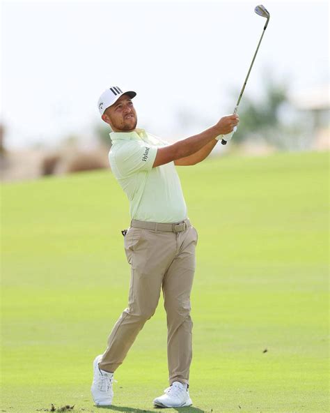 Download Xander Schauffele Full Body Golf Swing Wallpaper | Wallpapers.com