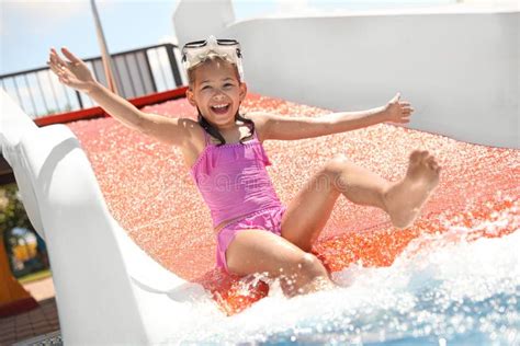 Girl on Slide at Water Park. Summer Vacation Stock Image - Image of ...