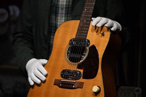 Kurt Cobain’s MTV ‘Unplugged’ Guitar Rakes in $6 Million - Bloomberg