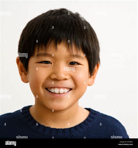 Portrait of young Asian boy smiling Stock Photo - Alamy