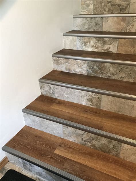 Luxury Vinyl Plank and Porcelain Tile Staircase Renovation