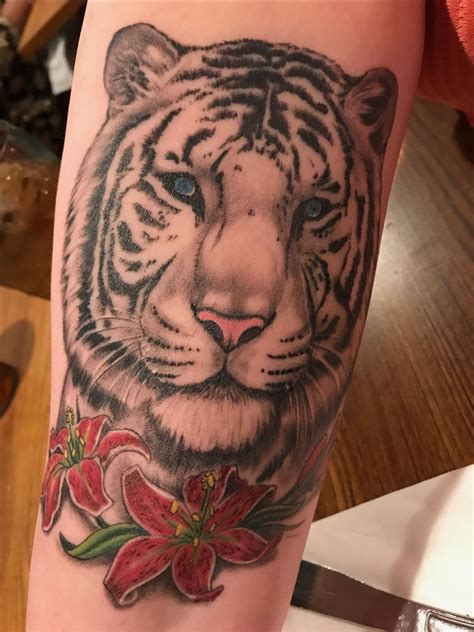 White tiger & lilys shoulder arm tattoo | Shoulder arm tattoos, Arm ...