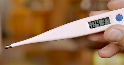 Hand Holding Digital Thermometer Displaying Stock Footage SBV-325765987 ...