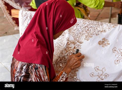 The technique of making batik by writing using a canting tool. Canting ...