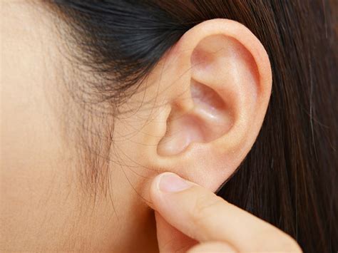 Pimple on the earlobe: Treatments, causes, and prevention