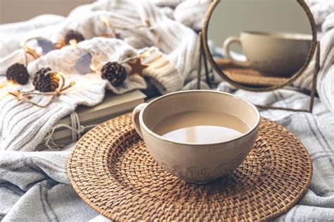 Free Photo | Cozy autumn composition with a big cup of coffee in bed