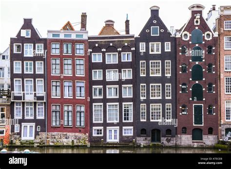 facades at Damrak canal, Amsterdam, Netherlands Stock Photo - Alamy