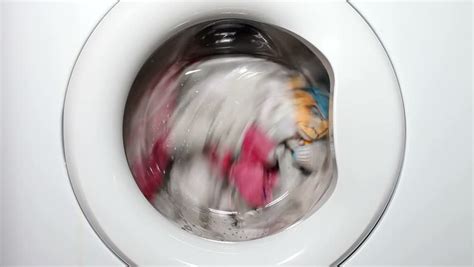 Close Up View Of Clothing Spinning In Washing Machine In Slow Motion ...