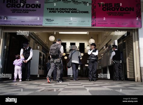 Police officers at West Croydon train station in South London ...