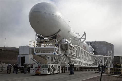 File photo of a Falcon 9 rocket rolling to the launch pad at Space ...