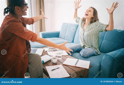 Two Young Women Work at Home on a Project, Happy People Celebrate ...