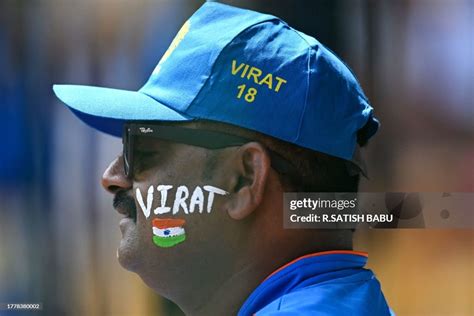 An Indian fan watches the 2023 ICC Men's Cricket World Cup one-day ...