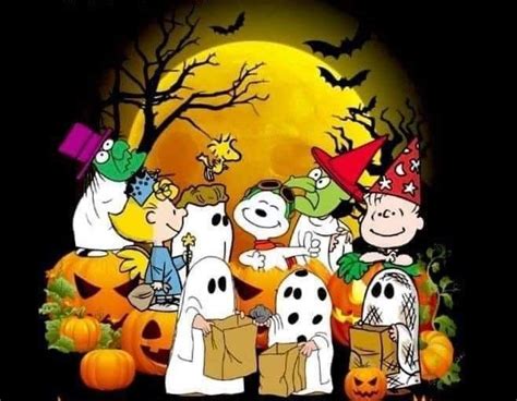 the peanuts gang on halloween with pumpkins and bats