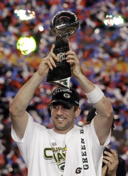 Aaron Rodgers holding Super Bowl trophy | | chippewa.com