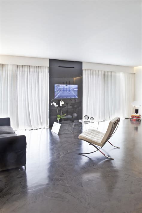 16 Times When Concrete Floors Made Living Rooms Look Stunning