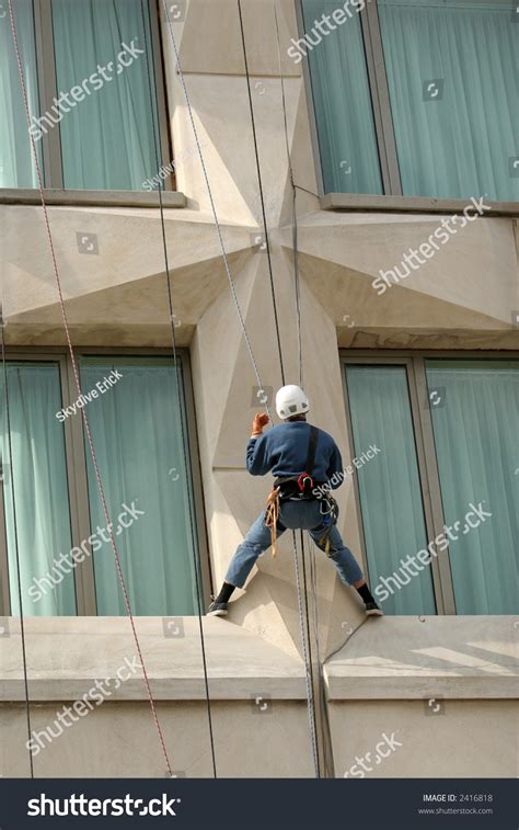 Man Climbing A Building Stock Photo 2416818 : Shutterstock