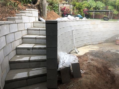 Curved wall with step | Landscaping retaining walls, Building a ...