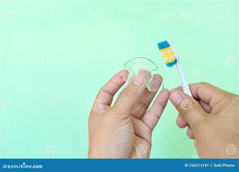 Retainer Cleaning Care and Maintenance Concept. Hand Holding Hawley ...