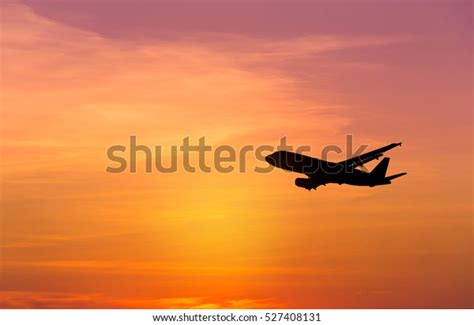 Silhouette Airplane Flying On Sunset Stock Photo (Edit Now) 527408131