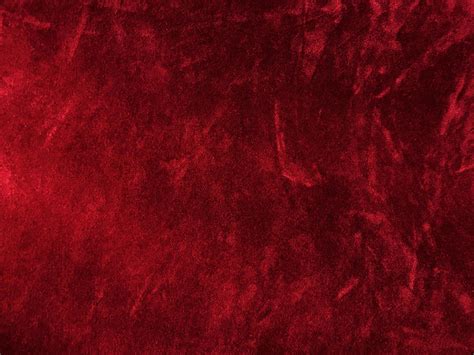 Dark red velvet fabric texture used as background. Empty dark red ...