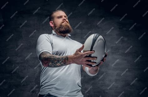 Free Photo | Portrait of bearded rugby player with tattoos on his arms