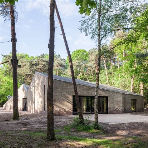 Angular brick theatre by Reset Architecture sits in a woodland clearing ...