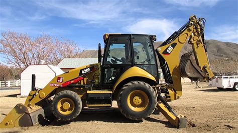 CAT Backhoe Start Up Procedures - YouTube