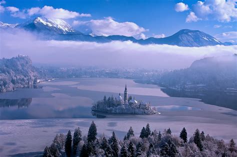 Photo Gallery: Lake Bled draped in winter white in the winter