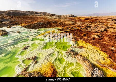 Acidic pools, mineral formations, salt deposits in the crater of Dallol ...