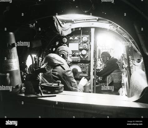 LANCASTER BOMBER interior with Radio Operator at left and Navigator ...