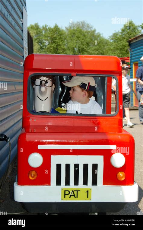 Young boy in a Pat the Postman ride post van Stock Photo - Alamy