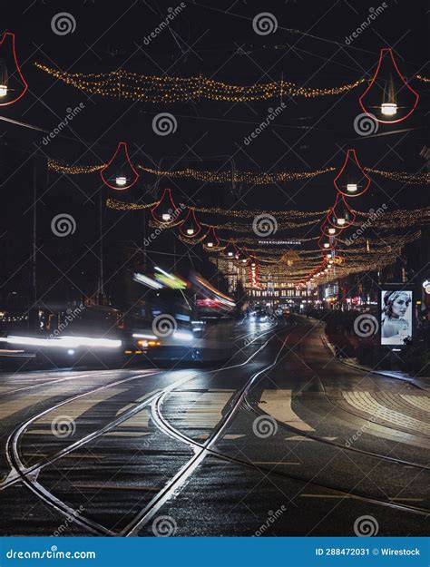 Vertical of Tram Driving on the Street of Damrak in Amsterdam ...