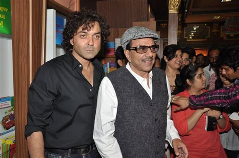 Bobby Deol with father Dharmendra posing at the launch of latest PEOPLE ...