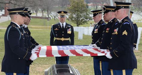 Who places flags at Arlington National Cemetery for Memorial Day?