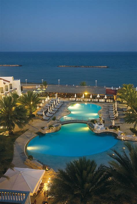 Princess Beach Hotel in Larnaca, Cyprus at dusk | Cyprus | Beach hotels ...