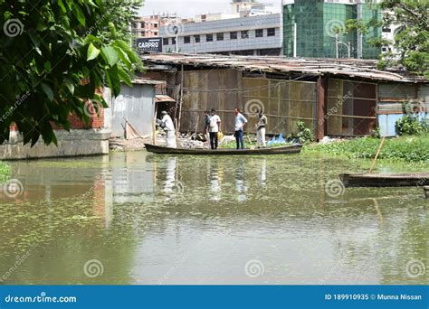 MOTIJHEEL,DHAKA/BANGLADESH-JULY 09 2020: Small Wooden Boat Carry ...