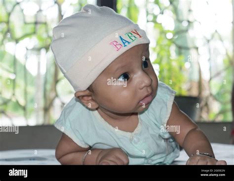 Cute baby hold his head up. Closeup portrait. Happy baby boy smiling ...