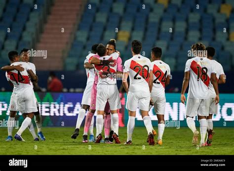 Players of Peru celebrate their team's 2-1 victory over Colombia during ...