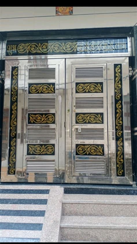 an entrance to a building with decorative glass doors