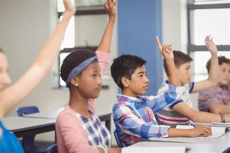 Student Raising Hand in Classroom Stock Photo - Image of education ...