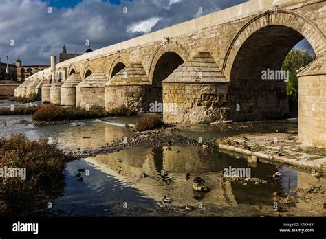 Guadalquivir river with the Roman bridge in Cordoba. Spain Stock Photo ...