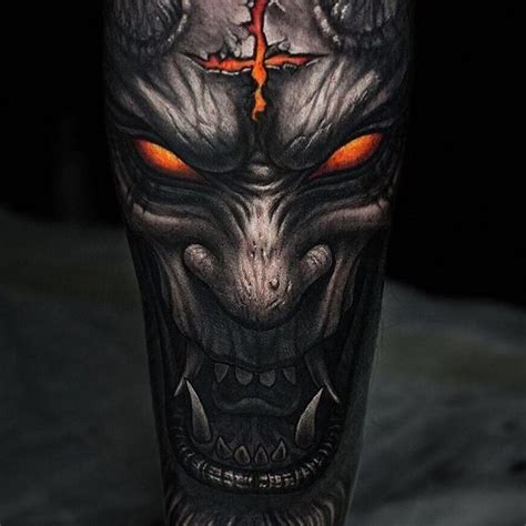 a man's leg with an evil face and cross on the top of it