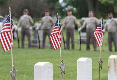 Remembering the Fallen - Memorial Day service at a cemetery with ...