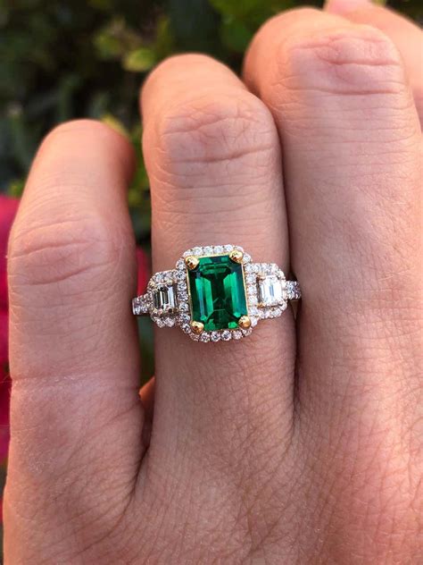 For Sale on 1stdibs - Emerald engagement ring set with a 1.24 carat ...