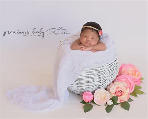 Gorgeous newborn African American baby girl sleeping in a white basket ...