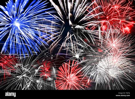 Blue white and red fireworks background Stock Photo - Alamy